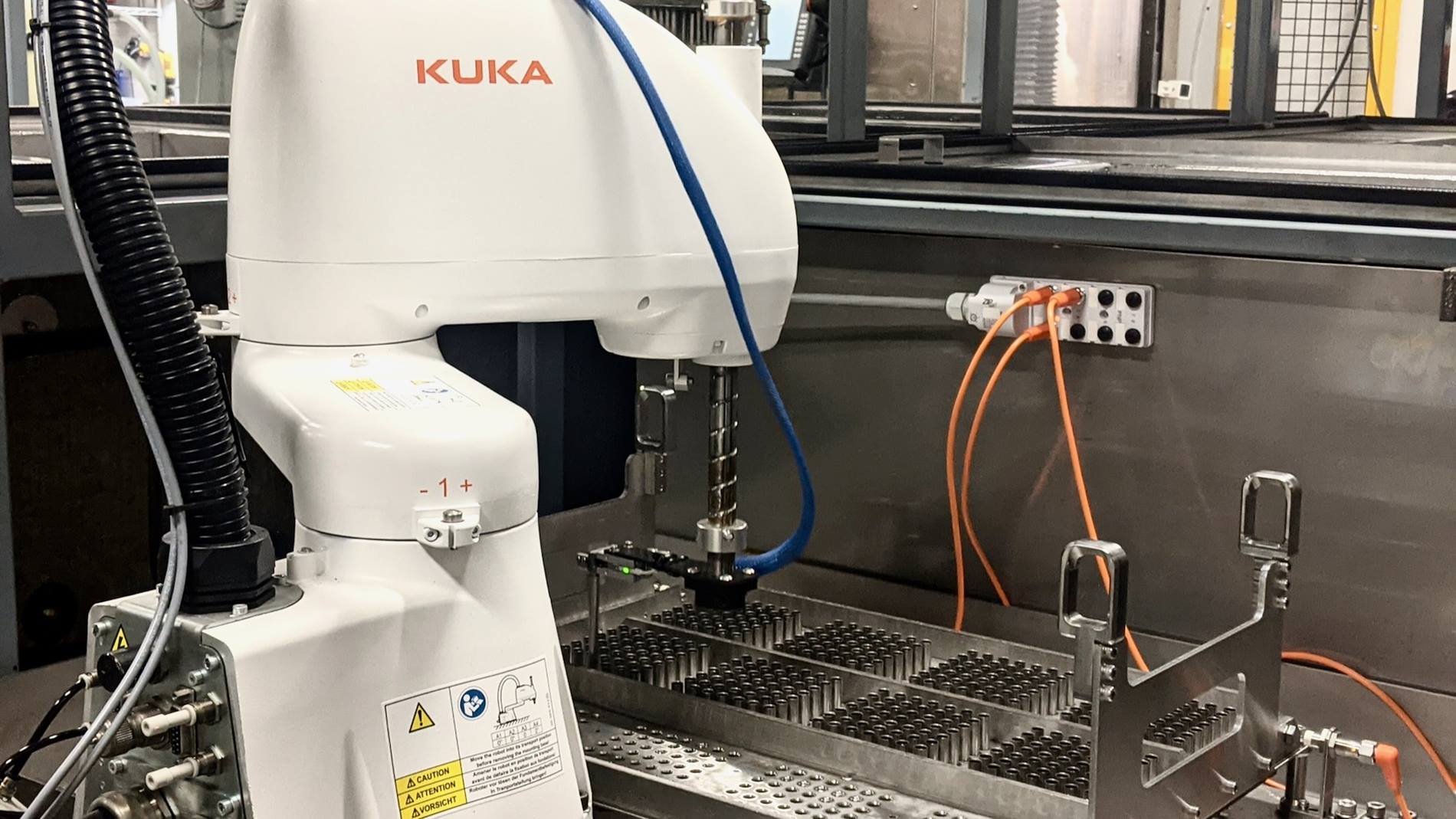 KR SCARA sorting parts for electrochemical machining.