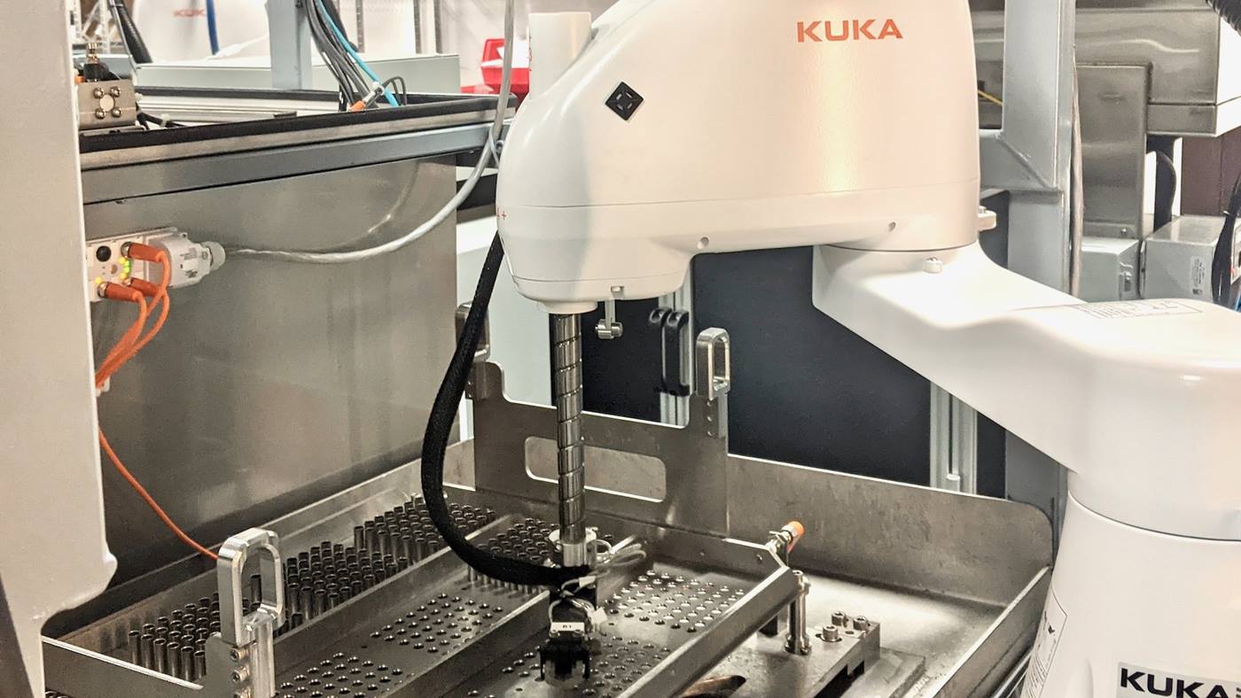 KR SCARA sorting parts for electrochemical machining.