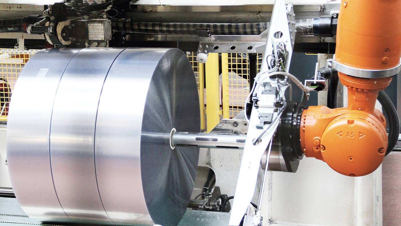 Gripper on the KUKA robot grips film reel